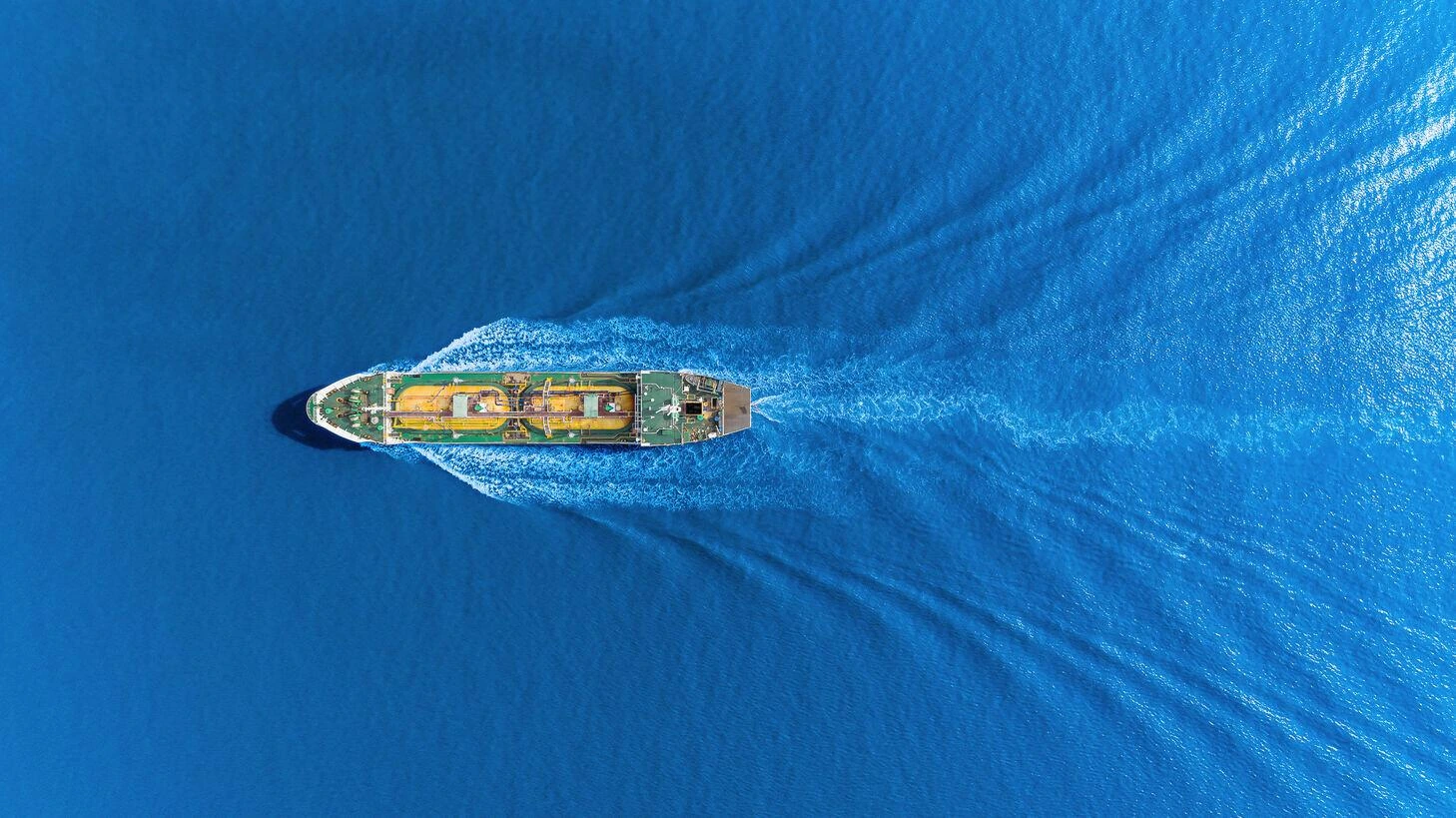 Unbranded vessel viewed from above while underway